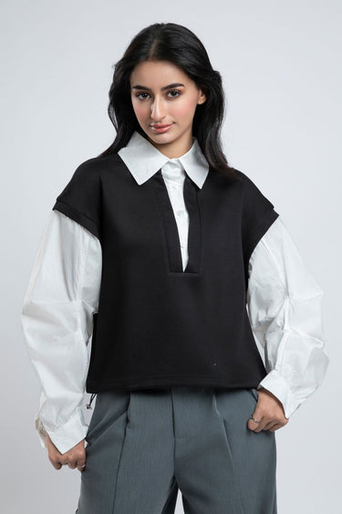 قميص رسمي نسائي بأكمام منفوشة وطبقات متباينة اللون والخامة